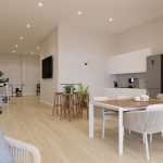 Interieur woonkamer met open keuken en sportfiets