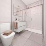 Moderne badkamer met witte inrichting en douchecabine