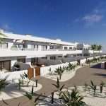 Appartementencomplex met witte muren en groen